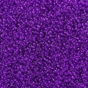 Close-up of numerous small, shiny purple beads.