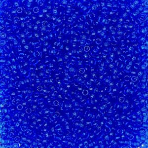 Close-up of blue transparent beads scattered densely.