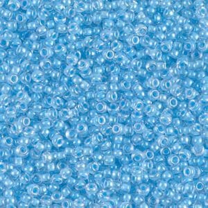 A close-up of numerous small, transparent blue beads.