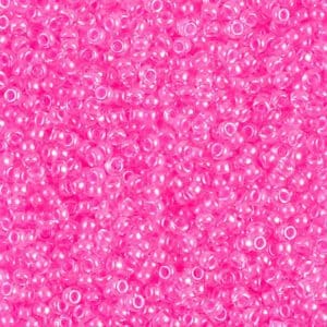 A close-up of numerous tiny pink beads densely packed together.