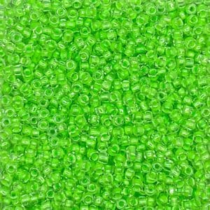Close-up of numerous small green translucent beads.