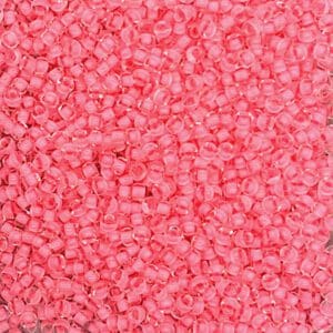 Close-up of small, pink plastic pellets.