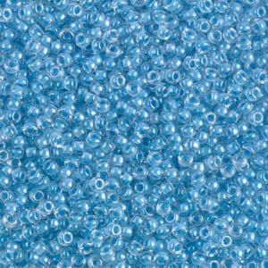 Close-up of small, transparent blue beads.
