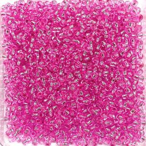 A vibrant pink and white abstract pattern with intricate, swirling designs.