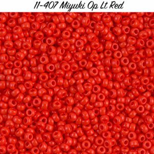 Bright red Miyuki seed beads scattered uniformly.