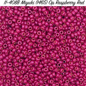 Close-up of raspberry red Miyuki seed beads with a glossy finish.