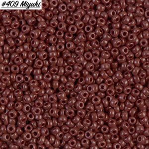 Close-up of tiny dark red beads labeled #409 Miyuki.