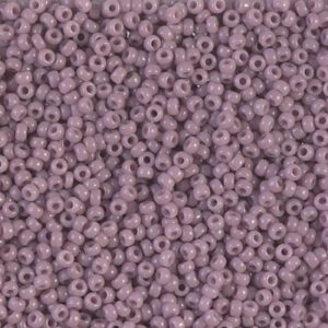 Close-up of numerous small purple beads densely packed together.
