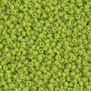 Close-up of small green beads with holes in the center.