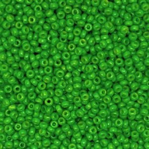 A close-up of many small green beads with holes in the center.
