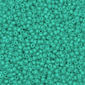Close-up of turquoise seed beads densely packed together.
