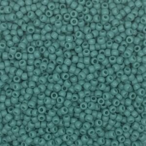 Close-up of numerous small teal beads.