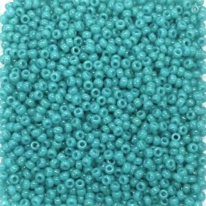 A close-up of small turquoise beads packed tightly together.