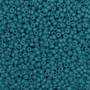Close-up of numerous small teal beads tightly packed together.
