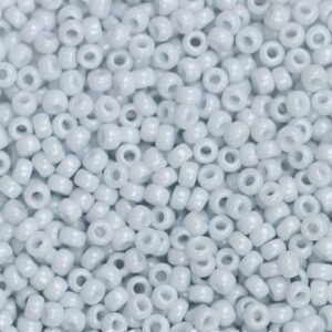 Close-up of numerous small, light blue beads.