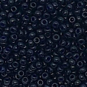 Close-up of small, dark blue beads with a glossy finish.