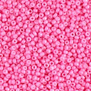 Close-up of vibrant pink seed beads densely packed together.