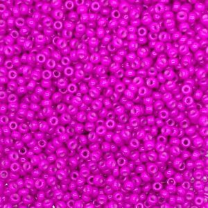 Close-up of numerous small, bright pink beads densely packed.