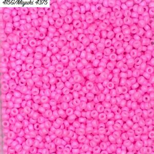 A close-up of numerous small pink beads.