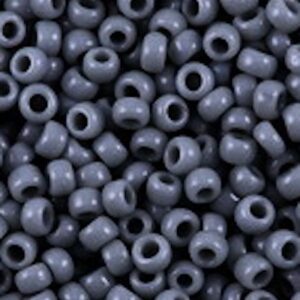 Close-up of many small gray beads with holes.