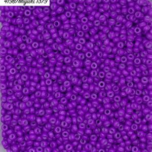 Close-up of numerous small purple beads with a glossy finish.