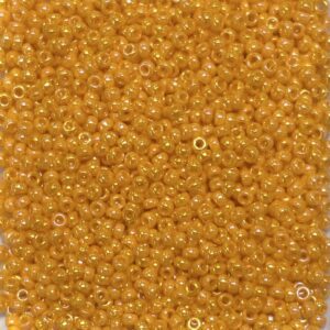 Close-up of numerous small, shiny orange beads.