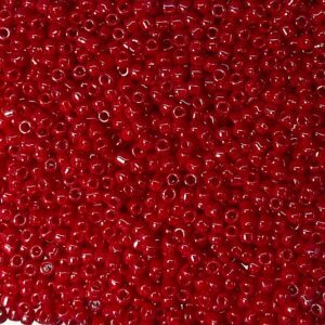 A close-up of numerous small red beads densely packed together.