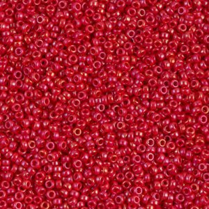 A close-up of numerous small red beads with a glossy finish.