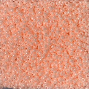Close-up of textured coral-colored fabric or material.