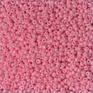 Close-up of numerous small pink beads densely packed together.