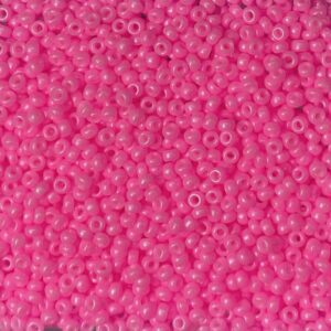 Close-up of numerous small, pink plastic beads.