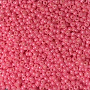 Close-up of many small pink beads densely packed.