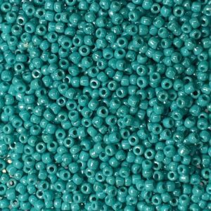 Close-up of small turquoise beads densely packed together.