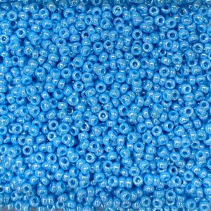 A close-up of numerous small blue beads densely packed together.