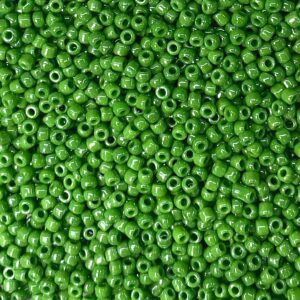 Close-up of numerous small green beads scattered.