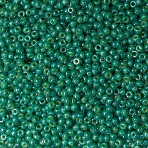 Close-up of numerous small green beads densely packed together.