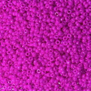 Close-up of numerous small, shiny purple beads.