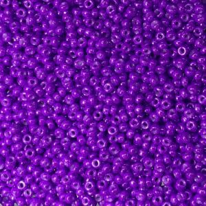 A close-up of numerous small, shiny purple beads.