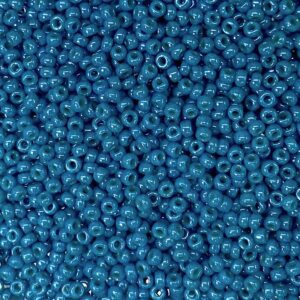 A close-up of numerous small blue beads.
