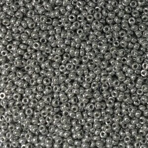 A close-up of numerous small, round, metallic beads.