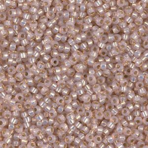 Close-up of numerous small, shiny, pinkish-beige beads.
