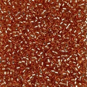 Close-up of tiny reddish-brown glass beads.