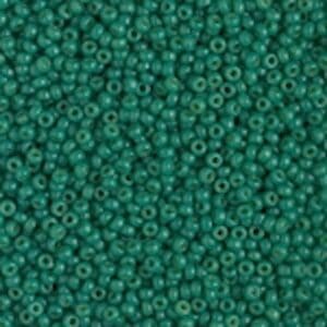 Matte teal round seed beads closeup
