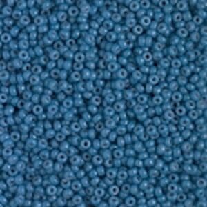 Muted teal round seed beads scattered closely