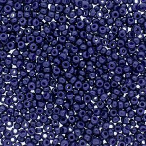 Close-up of numerous small, round, dark blue beads with silver centers.