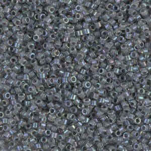 Close-up of small, translucent gray beads with a hole in the center.