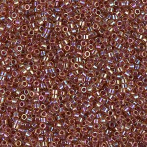 Close-up of small, shiny, metallic beads with a reddish-brown hue.