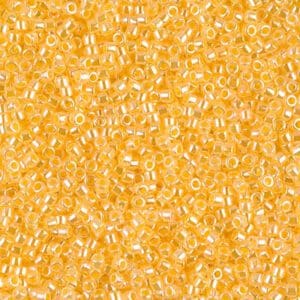 Close-up of small, translucent yellow beads scattered densely.