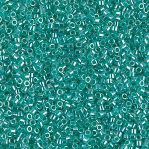 Translucent aqua glass seed beads close view