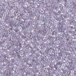 Close-up of numerous small transparent lavender beads.